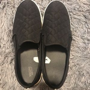 Lightly used black quilted slip ons